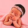 baby, blanket, child, closed_eyes, cozy, cute, face, flower, hand, headband, infant, newborn, peaceful, pink, portrait, resting, skin, sleeping, soft, warm