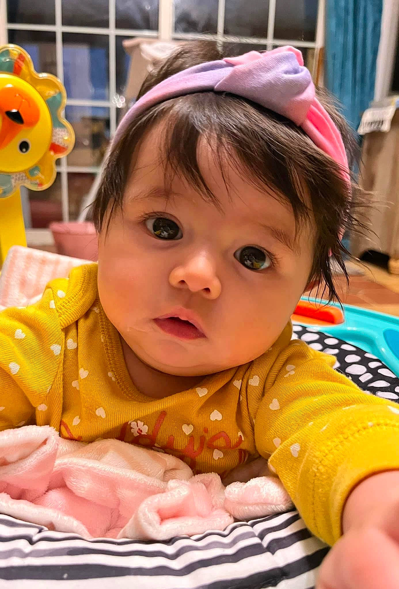 Arayah is registered to the contest to win money with this photo: baby, baby_toddler_clothing, bangs, cheek, child, eye, eyebrow, eyelash, facial_expression, fun, grass, happy, iris, leisure, nose, person, pink, sitting, skin, snapshot