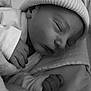 apparel, baby, black_and_white, blanket, child, close_up, cozy, cute, face, hand, hat, indoors, infant, newborn, peaceful, portrait, rest, sleeping, soft, toddler