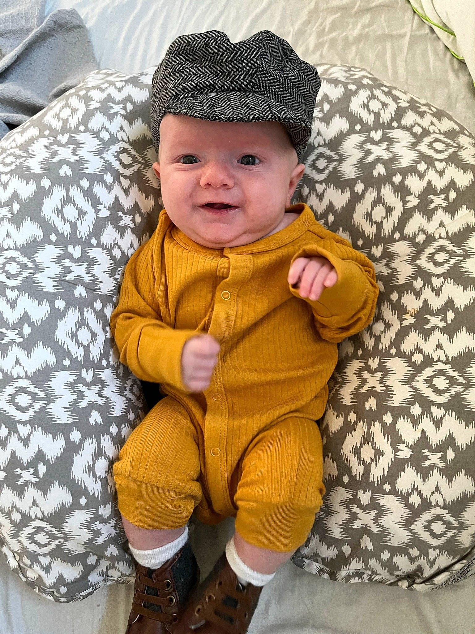 Lyric joined the competition — help win amazing prizes! baby, baby_products, baby_toddler_clothing, cap, cheek, child, comfort, couch, eye, face, fashion_accessory, head, headwear, linens, outerwear, pattern, person, sitting, sleeve, smile
