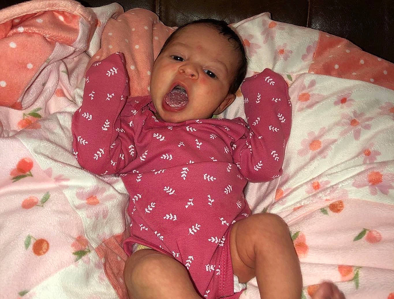 Amari joined the competition — help win amazing prizes! abdomen, baby, baby_toddler_clothing, bed, bedding, bedtime, cheek, child, comfort, eye, happy, head, linens, mouth, pattern, person, pink, skin, textile, thumb