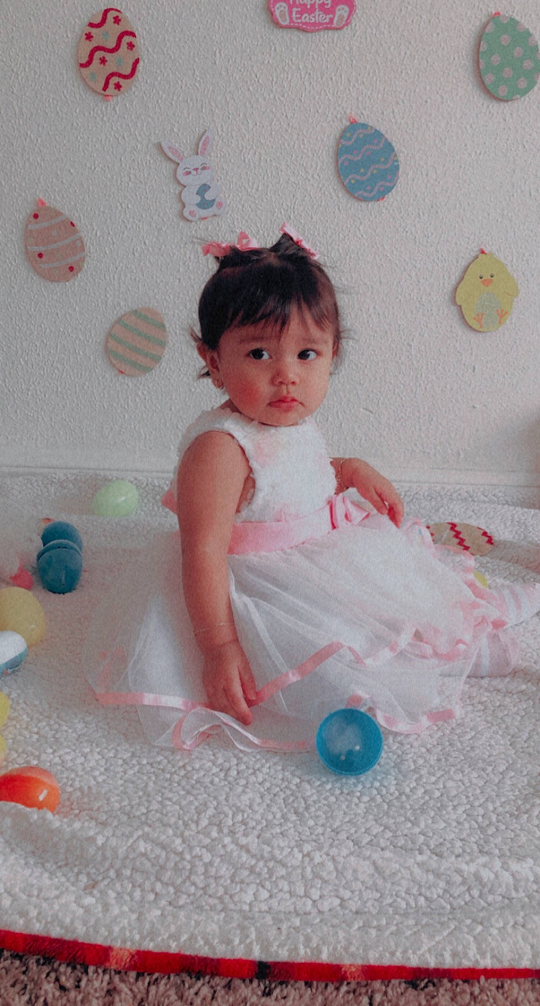 Catalina is registered to the contest to win money with this photo: baby, baby_toddler_clothing, bangs, child, dress, embellishment, flooring, fun, happy, magenta, pattern, peach, person, pink, play, product, room, sitting, skin, textile