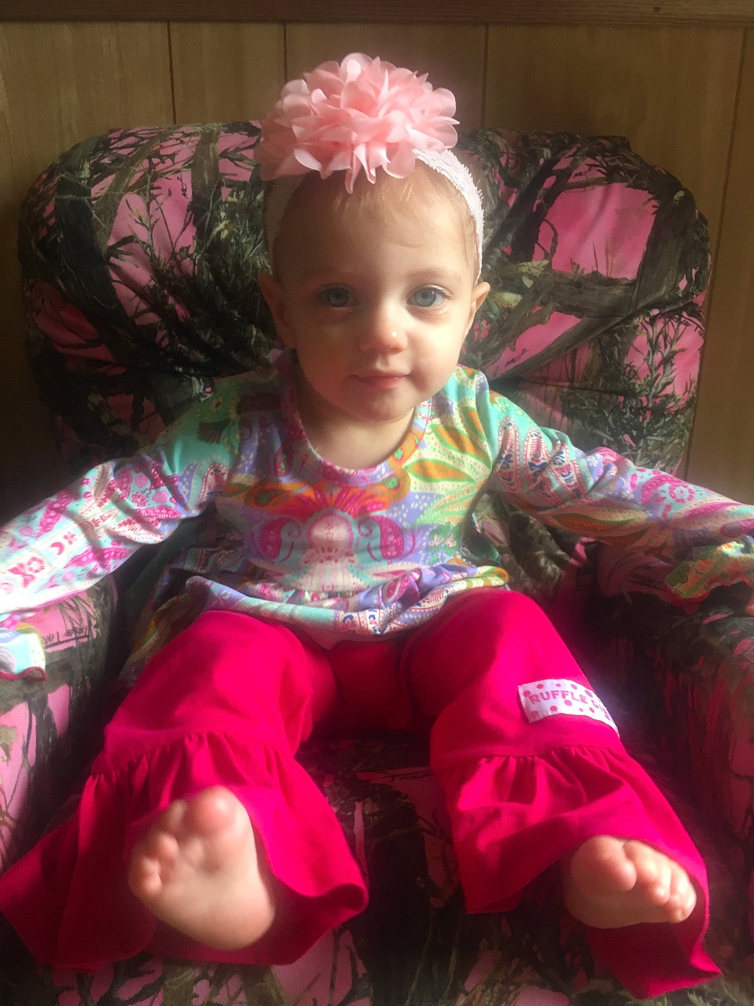 Keira is registered to the contest to win money with this photo: baby, cheek, child, hair, hair_accessory, hair_coloring, headband, magenta, person, pink, sitting, toddler