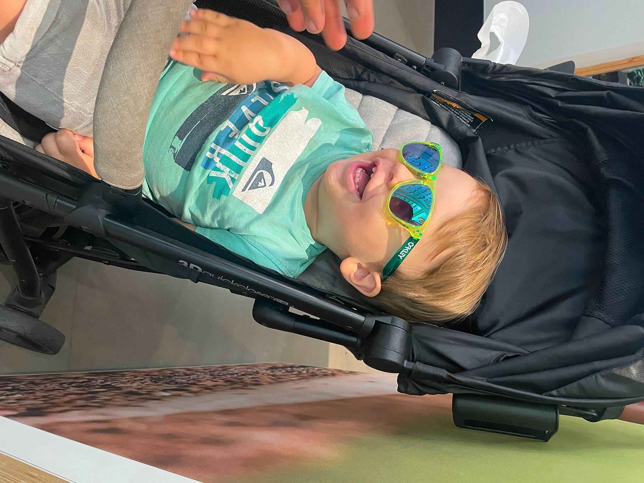 Levi is registered to the contest to win money with this photo: auto_part, automotive_exterior, baby, baby_carriage, baby_products, bag, child, comfort, fun, person, personal_protective_equipment, product, smile, toddler, wheel, windshield