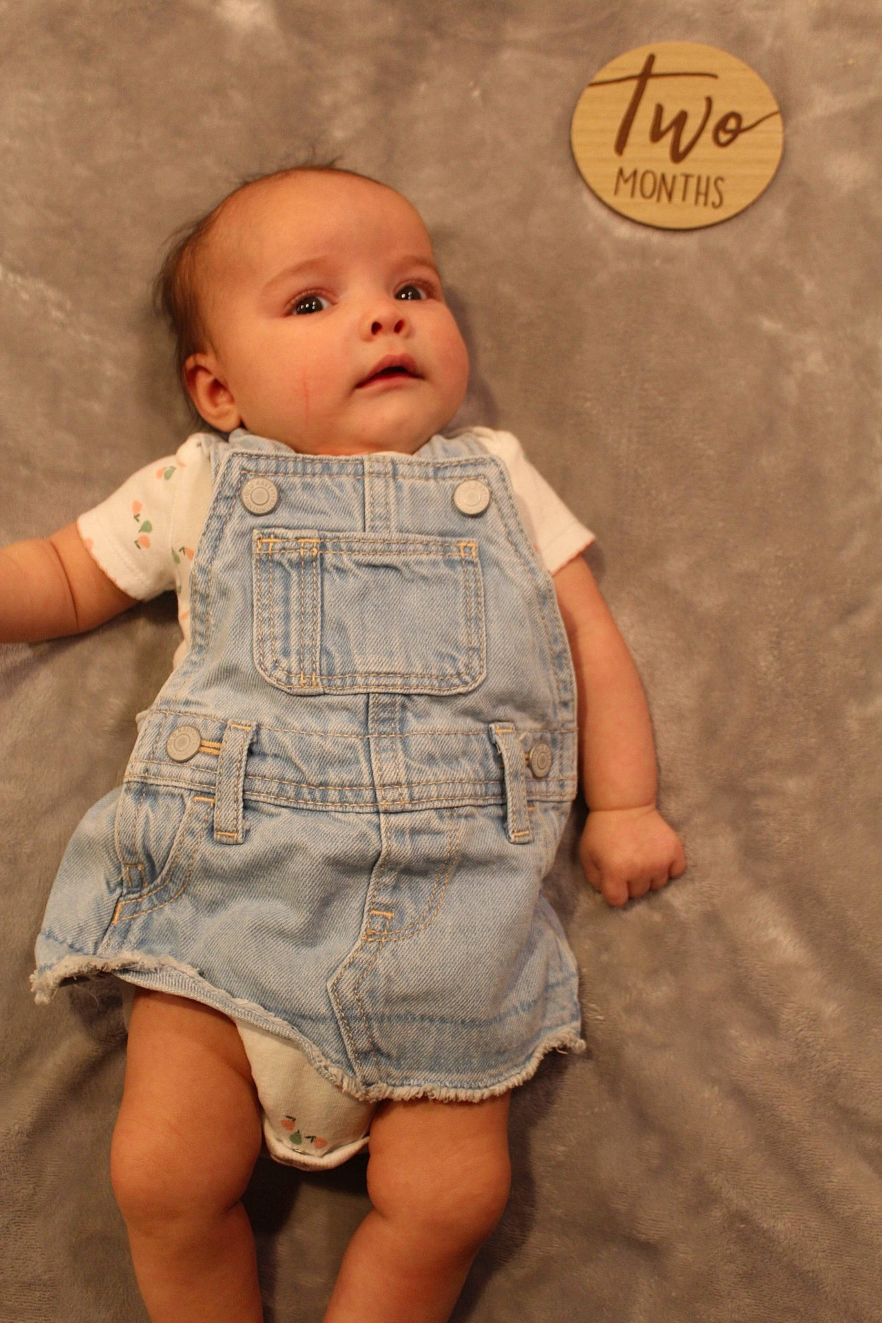 Evangeline is registered to the contest to win money with this photo: baby, baby_toddler_clothing, cheek, clothing, eye, eyelash, finger, gesture, head, human_body, iris, joint, lip, nose, one_piece_garment, outerwear, person, skin, sleeve, textile