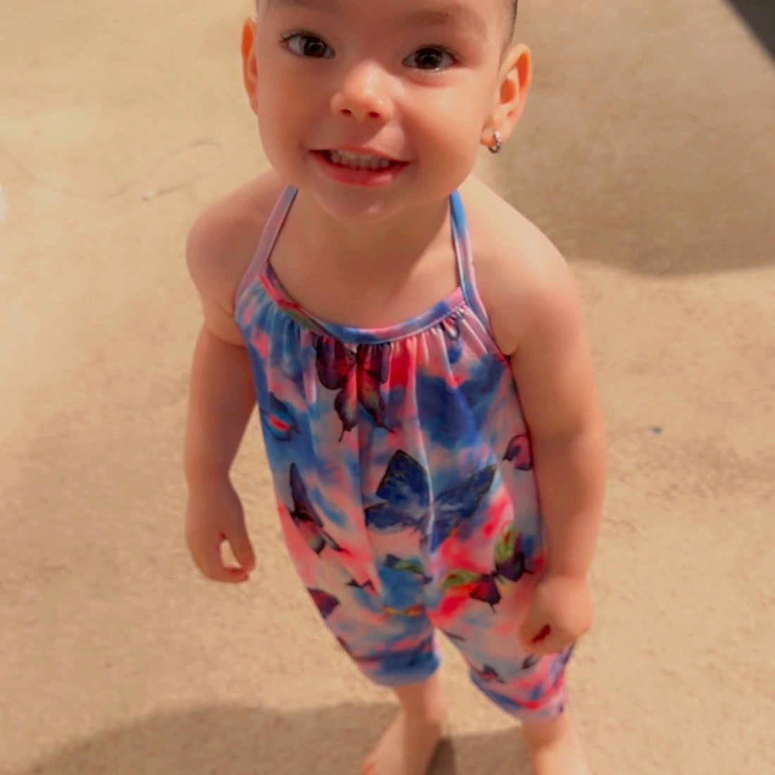 Amora joined the competition — help win amazing prizes! child, toddler, smile, barefoot, hair_bow, colorful_clothing, indoor, carpet, standing, happy, cute, portrait, person, young, fashion, innocent, playful, girl, casual_wear, bright