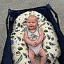 Bowen joined the competition — help win amazing prizes! baby, infant, smile, face, pillow, pattern, leaf, stroller, fabric, asphalt, outdoor, clothing, sitting, comfort, cute, child, person, skin, head, legs