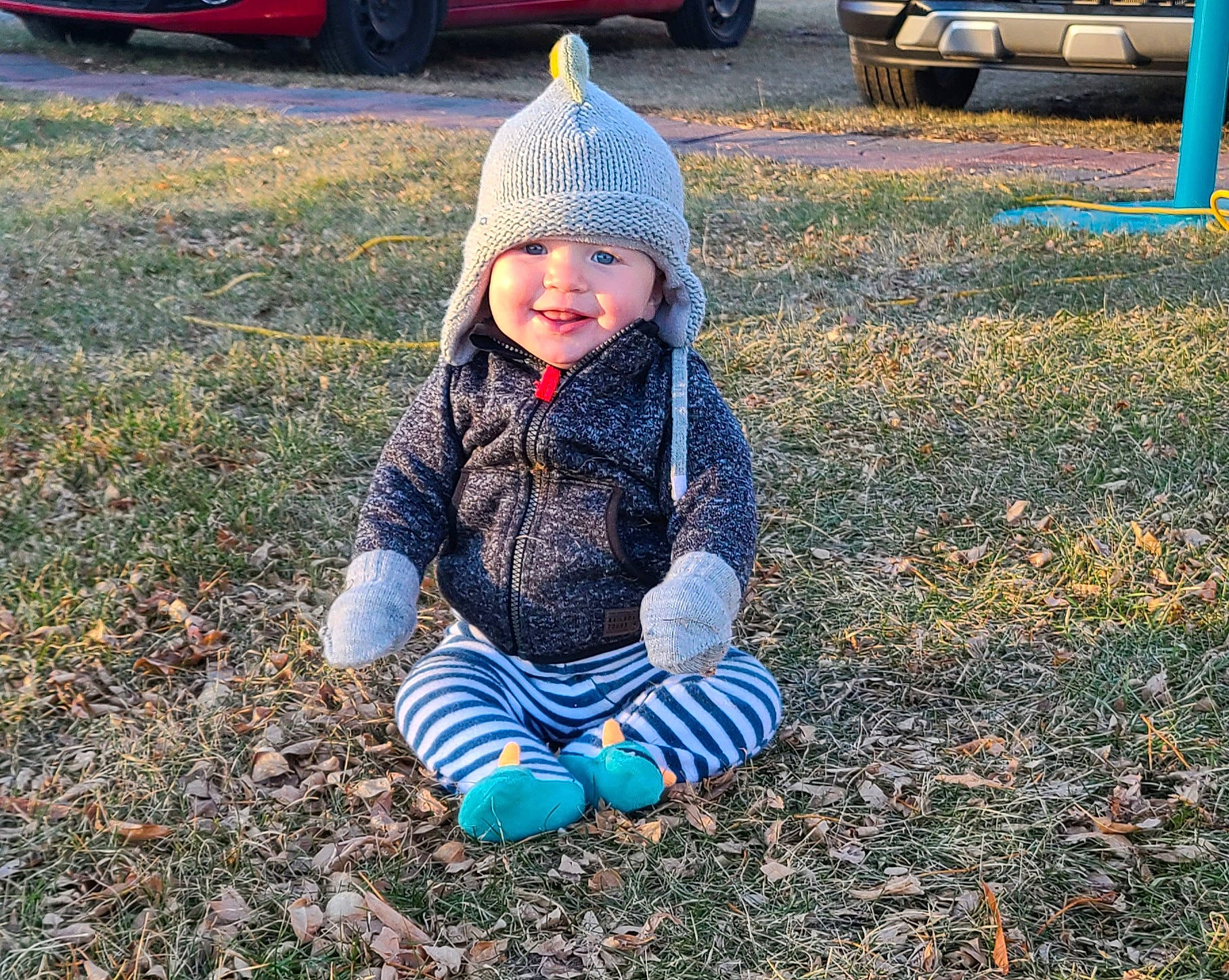 Keith joined the competition — help win amazing prizes! automotive_lighting, automotive_tire, baby_toddler_clothing, blue, grass, headwear, jacket, light, motor_vehicle, outerwear, people_in_nature, person, plant, public_space, smile, sunlight, tire, toddler, vehicle, vehicle_registration_plate