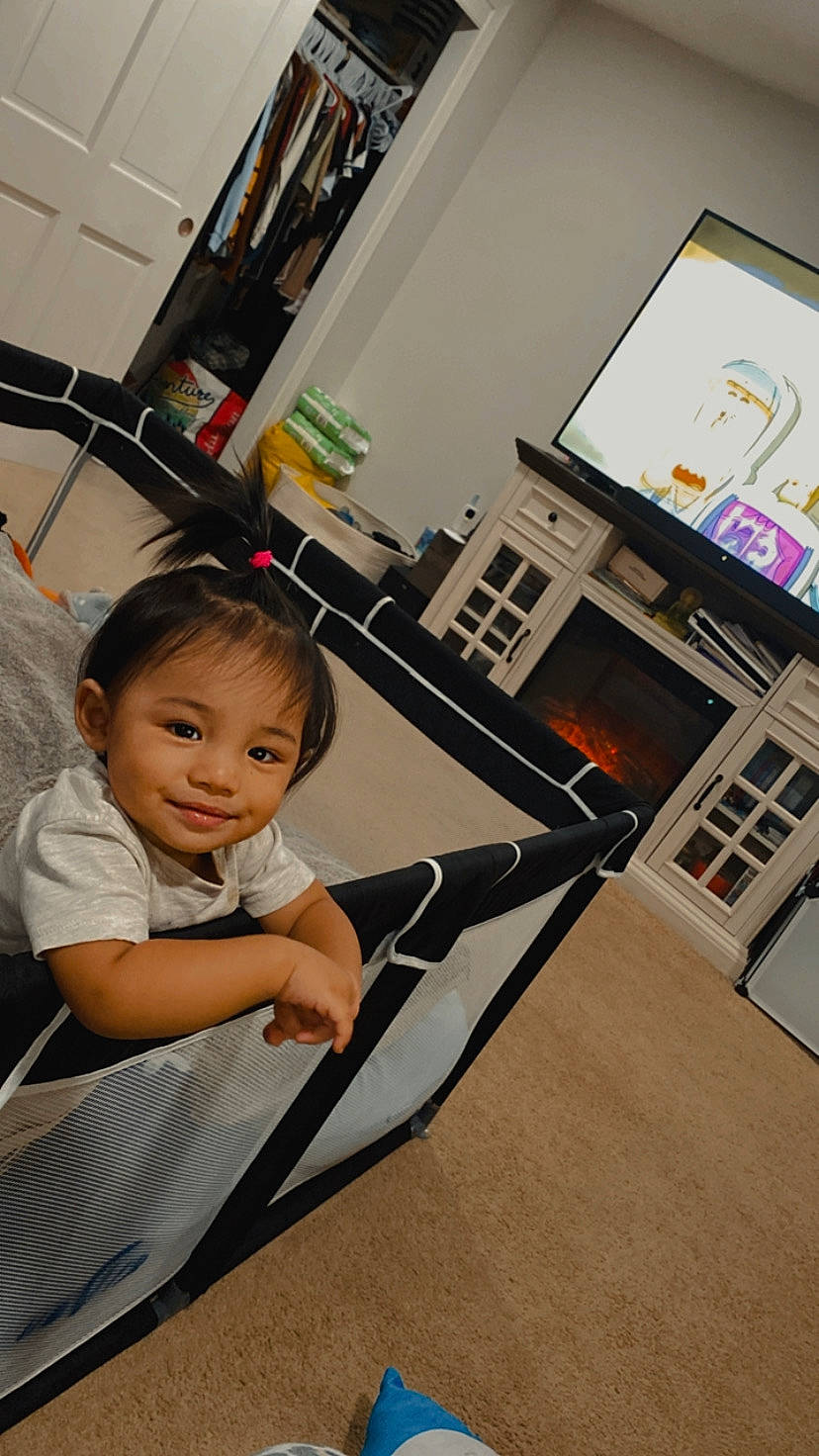 Castiel is registered to the contest to win money with this photo: baby, baby_toddler_clothing, child, comfort, display_device, floor, flooring, fun, happy, hardwood, joy, leisure, machine, person, play, recreation, room, sitting, smile, t_shirt