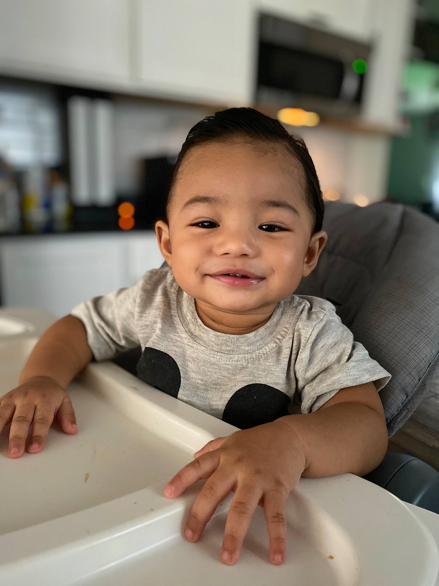 Castiel is registered to the contest to win money with this photo: baby, baby_toddler_clothing, cheek, child, comfort, cooking, dishware, finger, flooring, fun, happy, joy, person, product, sitting, sleeve, smile, t_shirt, table, tableware