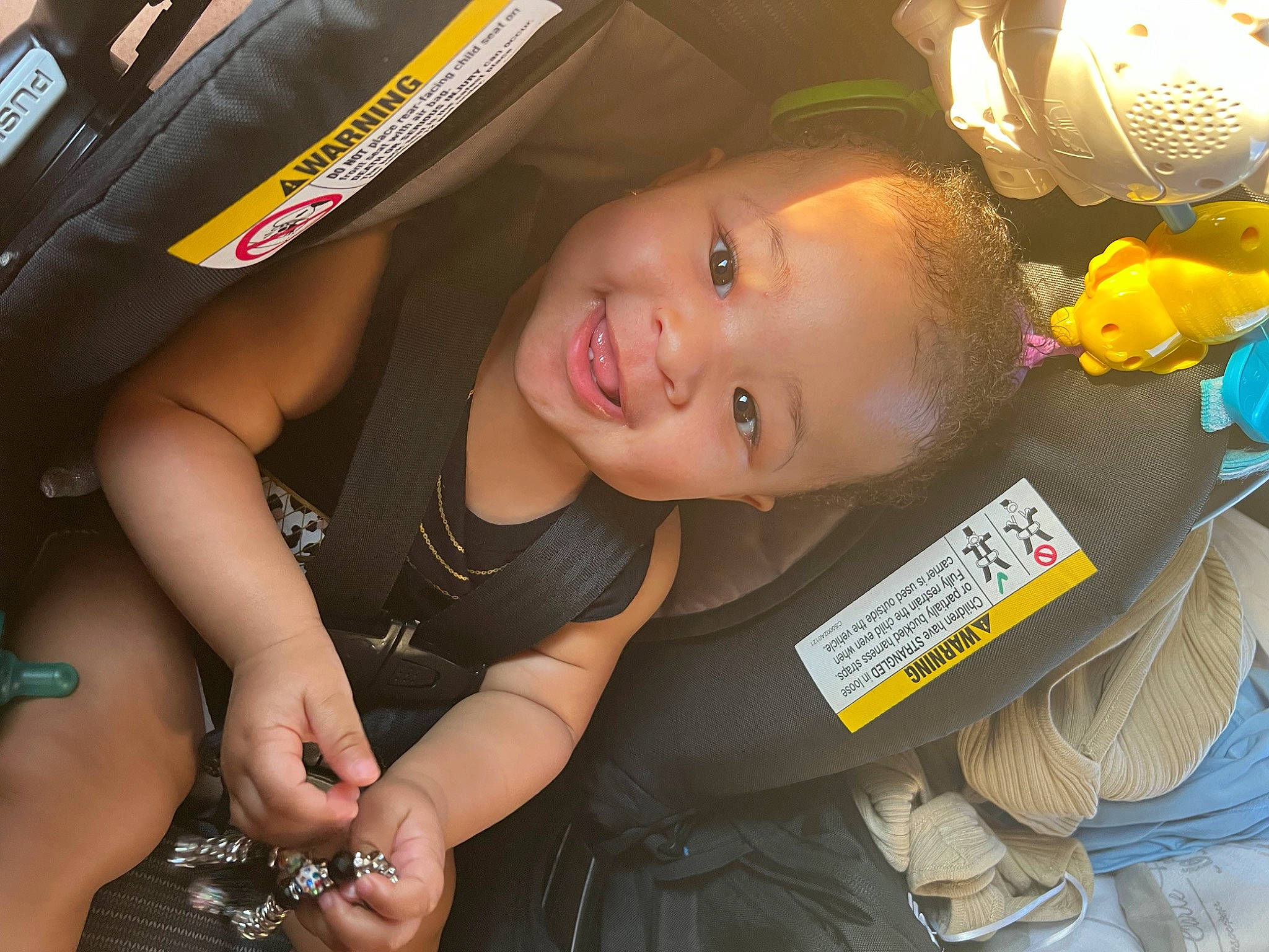 Serenity is registered to the contest to win money with this photo: auto_part, automotive_design, automotive_exterior, automotive_tire, car_seat, child, elbow, finger, fun, happy, human_leg, joy, leisure, motor_vehicle, person, recreation, smile, snapshot, thigh, toddler