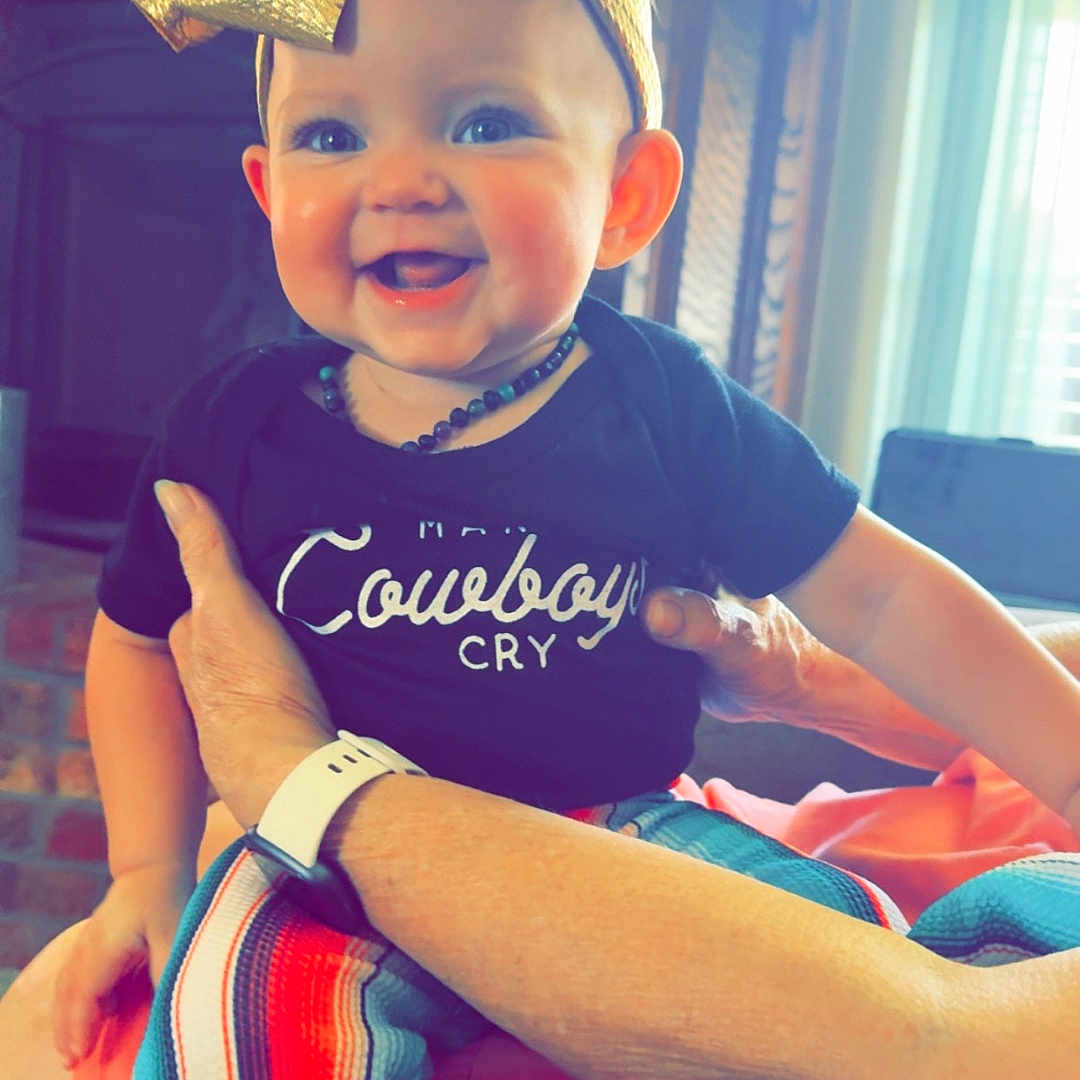 Raelynn is registered to the contest to win money with this photo: accessories, baby, bodypart, clothing, costume, dress, face, happy, hat, head, indoors, laughing, mouth, pants, person, photography, portrait, shorts, smile, t_shirt