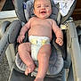 baby, baby_seat, blanket, child, closeup, clothing, concrete, diaper, expression, face, foot, hand, happy, infant, outdoor, pacifier, relaxing, seat, skin, smiling