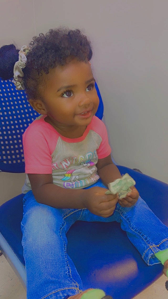 Janiya is registered to the contest to win money with this photo: baby_toddler_clothing, blue, comfort, electric_blue, eye, face, finger, fun, hair, hairstyle, happy, head, knee, leg, leisure, person, skin, smile, t_shirt, thigh