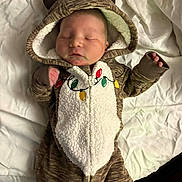 Maddox joined the competition — help win amazing prizes! baby, sleeping, onesie, reindeer, christmas_lights, hood, blanket, infant, cute, holiday, cozy, warm, child, soft, pajamas, face, hands, feet, bed, resting