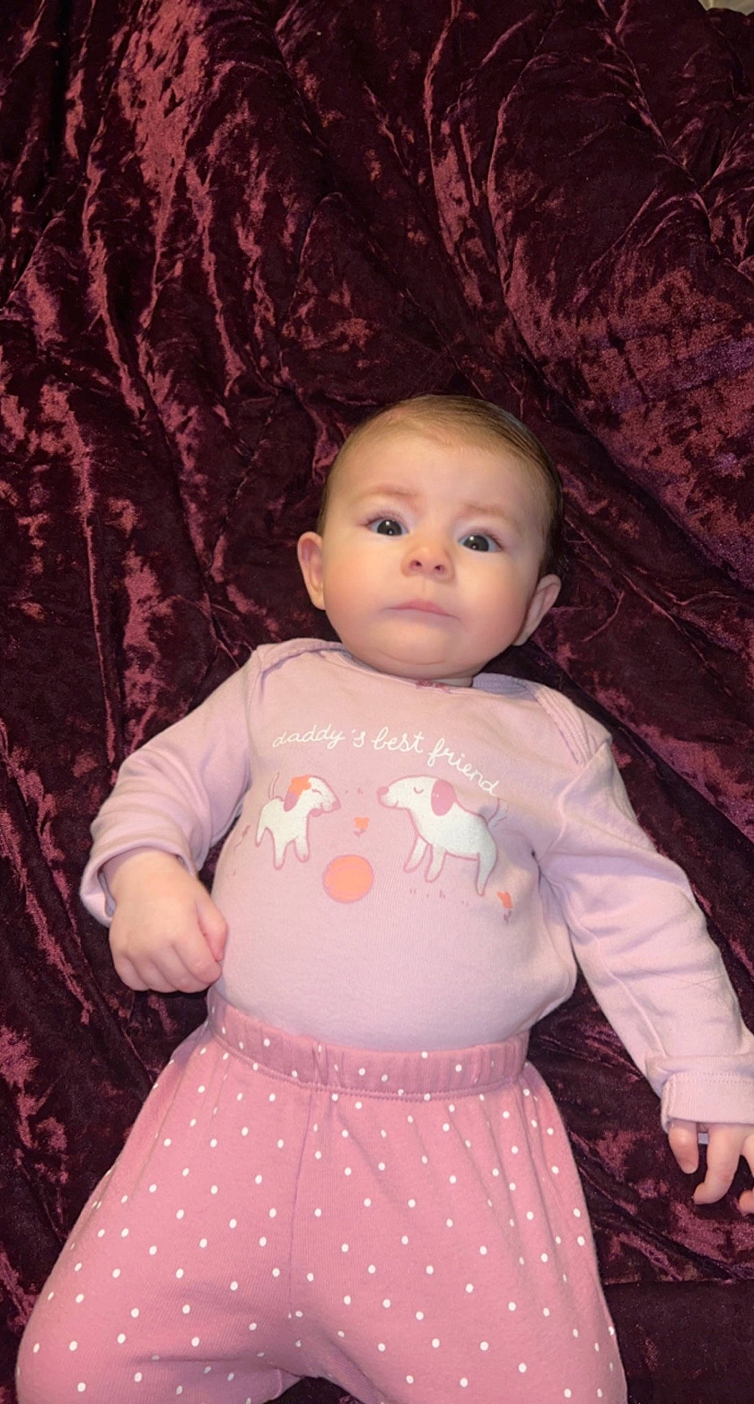 Oakleigh is registered to the contest to win money with this photo: baby_toddler_clothing, cheek, chin, eye, eyelash, head, human_body, iris, lip, neck, nose, one_piece_garment, organ, person, pink, shoulder, skin, sleeve, standing, textile