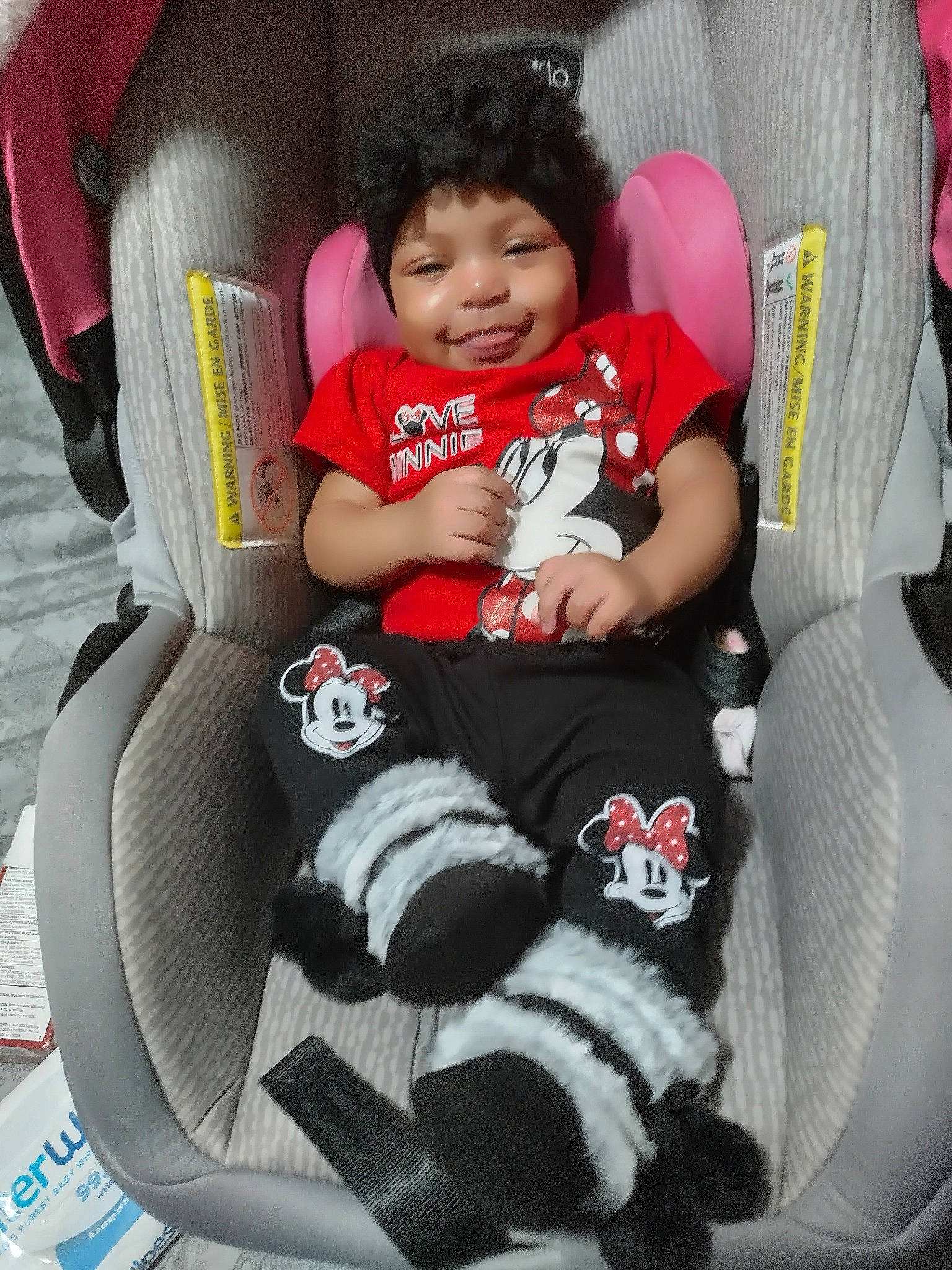 Honey is registered to the contest to win money with this photo: auto_part, baby, baby_carriage, baby_products, baby_safety, baby_toddler_clothing, black, car_seat, car_seat_cover, carmine, child, comfort, face, happy, head, joy, lap, person, sitting, smile