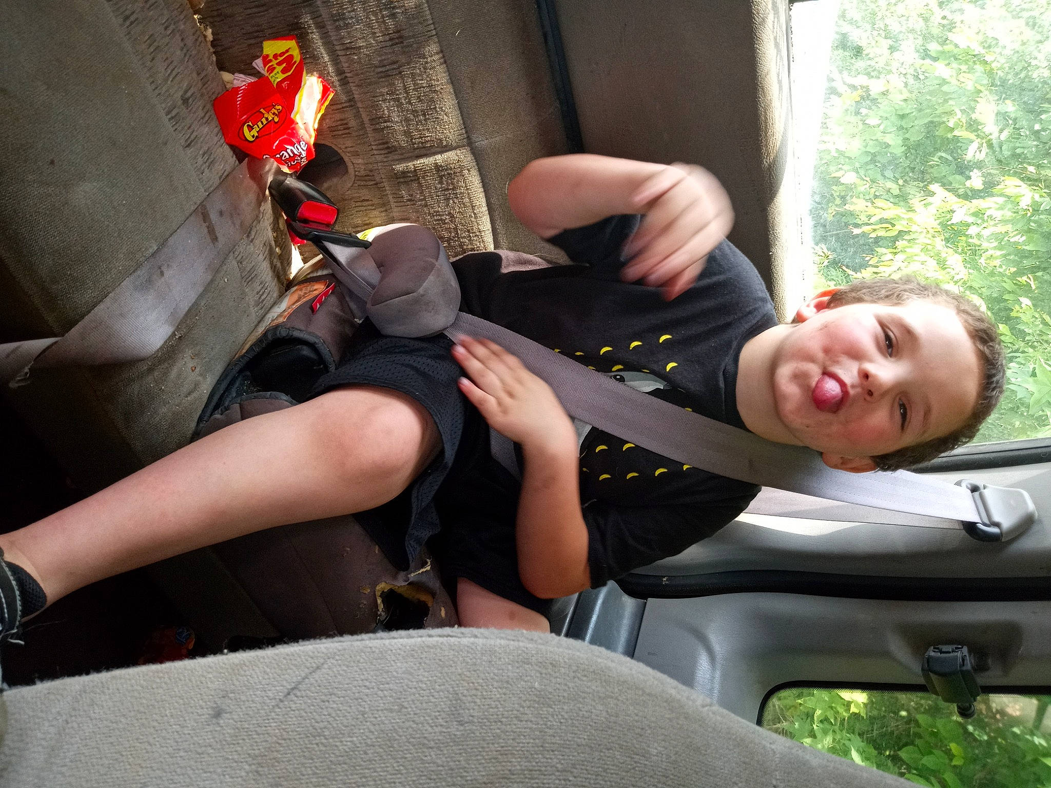 Caleb is registered to the contest to win money with this photo: auto_part, automotive_design, automotive_exterior, car, dress, fun, grass, human_leg, joint, knee, lap, leg, motor_vehicle, person, plant, smile, thigh, tree, vehicle, vehicle_door