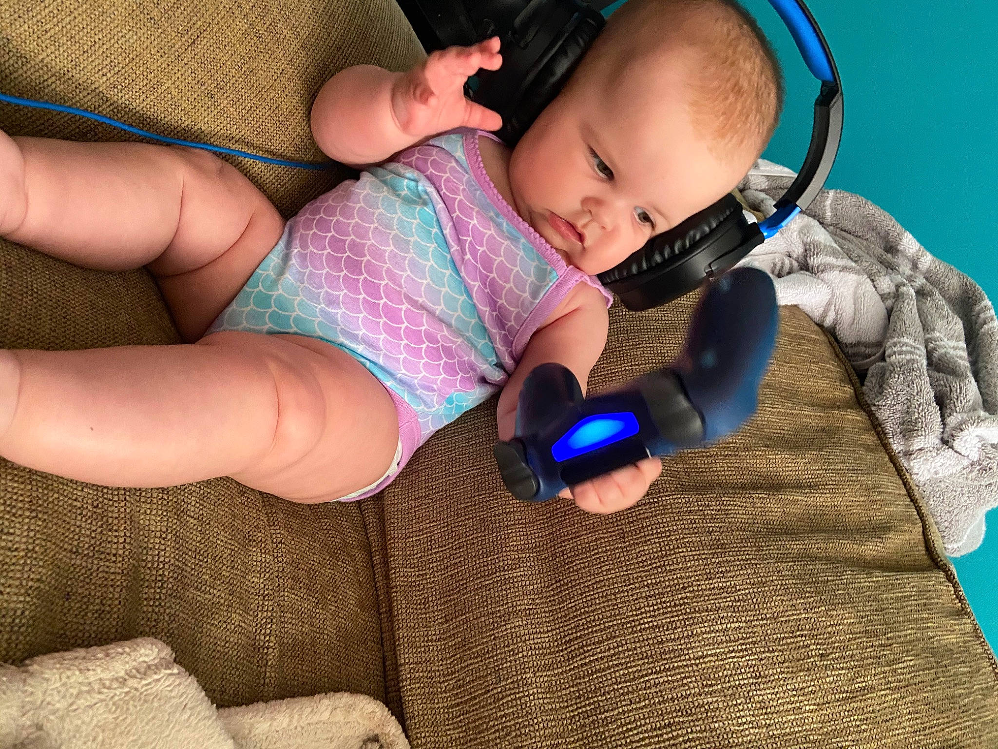Leyla joined the competition — help win amazing prizes! arm, audio_equipment, baby, child, comfort, ear, electronic_device, finger, gadget, hand, headphones, leg, neck, nose, person, play, skin, sleep, technology, toddler