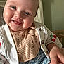 Mhiran joined the competition — help win amazing prizes! baby, smiling, face, child, cardigan, clothing, bib, hand, indoor, cute, portrait, blue_eyes, cheeks, happy, infant, patterned_clothing, sitting, head, skin, furniture