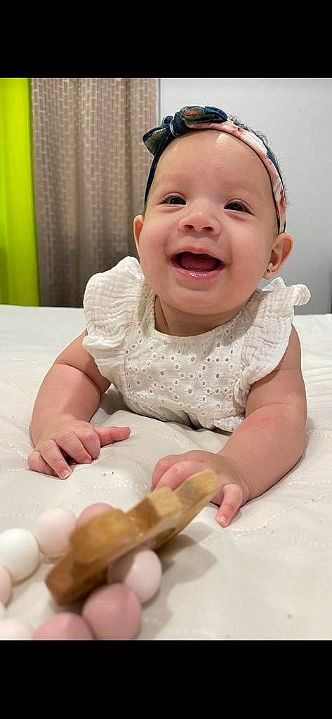 Kyomi joined the competition — help win amazing prizes! baby, baby_laughing, baby_toddler_clothing, cheek, child, curtain, dress, facial_expression, finger, fun, gesture, happy, head, person, skin, sleeve, smile, tableware, thumb, toddler