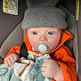 Matthew joined the competition — help win amazing prizes! baby, pacifier, hat, orange_clothing, blanket, car_seat, child, wide_eyes, hand, sitting, safety_strap, warning_label, indoor, cute, infant, knit_hat, soft_blanket, clothing, person, face