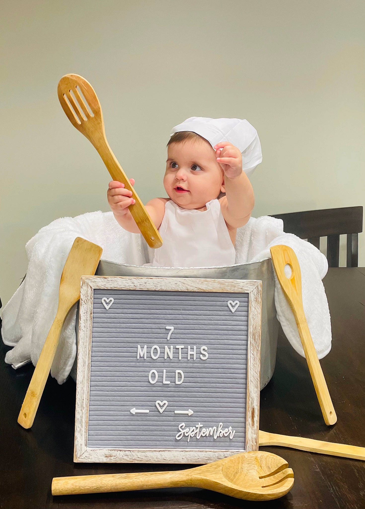 Becky is registered to the contest to win money with this photo: baby, baby_products, baby_toddler_clothing, chair, child, dress, eye, fashion_accessory, flash_photography, font, fun, gesture, hand, happy, human_body, person, room, sitting, smile, toddler