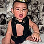 Juan joined the competition — help win amazing prizes! baby, infant, crown, black_suspender, bow_tie, smiling, fluffy_blanket, sitting, cute, playful, indoors, portrait, child, happy, black_and_white_background, face, hand, foot, young_child, celebration
