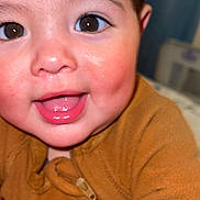Juan joined the competition — help win amazing prizes! baby, child, face, smile, eyes, brown_eyes, closeup, cozy, clothing, zipper, reindeer_design, happy, infant, cute, warm, indoors, skin, mouth, tongue, cheeks