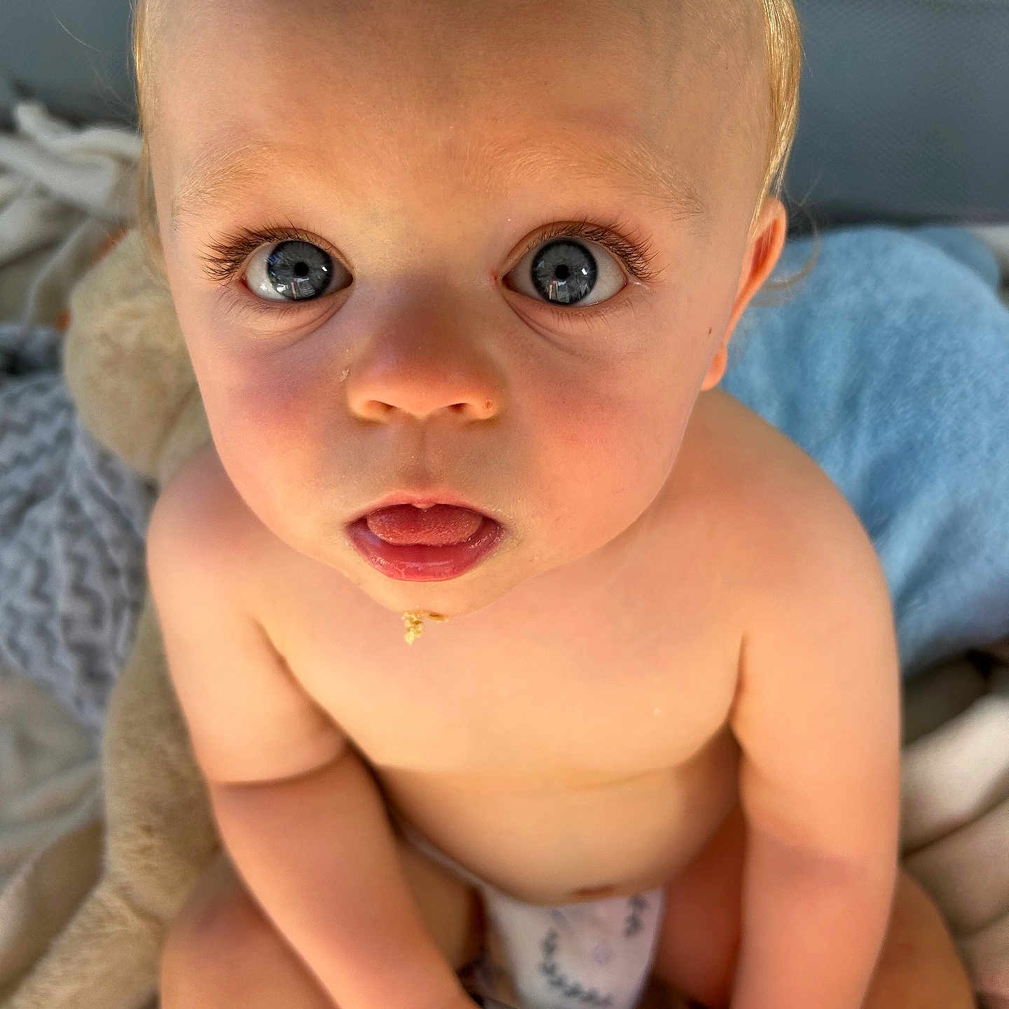 Jayden is registered to the contest to win money with this photo: baby, bodypart, couch, cutlery, eating, face, finger, food, frown, furniture, hand, head, mouth, newborn, person, photography, portrait, sad, spitting, spoon