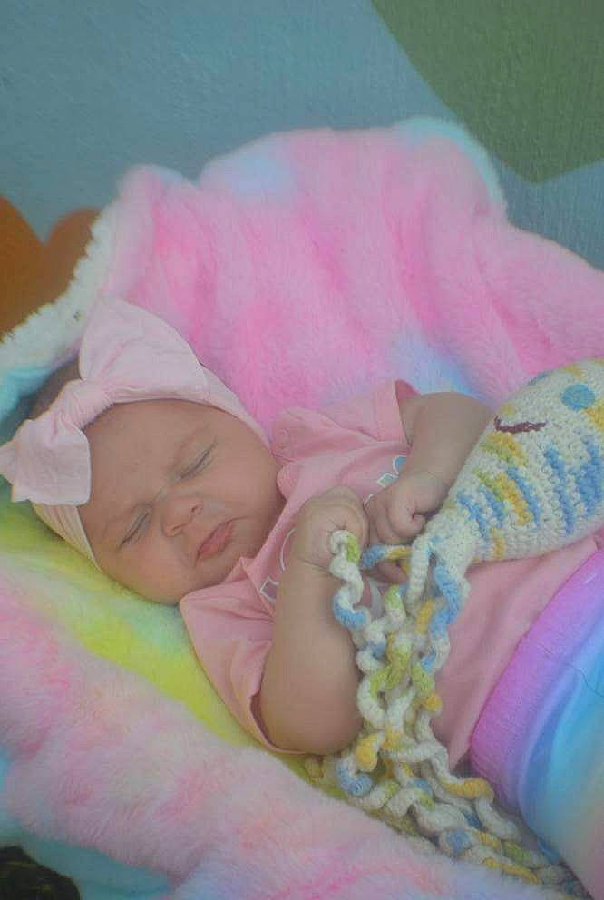 Thyra joined the competition — help win amazing prizes! baby, baby_sleeping, baby_toddler_clothing, bed, bed_sheet, bedding, bedtime, child, comfort, fun, grass, happy, headwear, linens, magenta, nap, person, petal, pink, smile