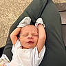 Stetson joined the competition — help win amazing prizes! newborn, baby, infant, sleeping, stretching, mittens, white_shirt, blanket, lap, person, legs, comfort, peaceful, relaxed, cute, young_child, indoor, clothing, skin, human
