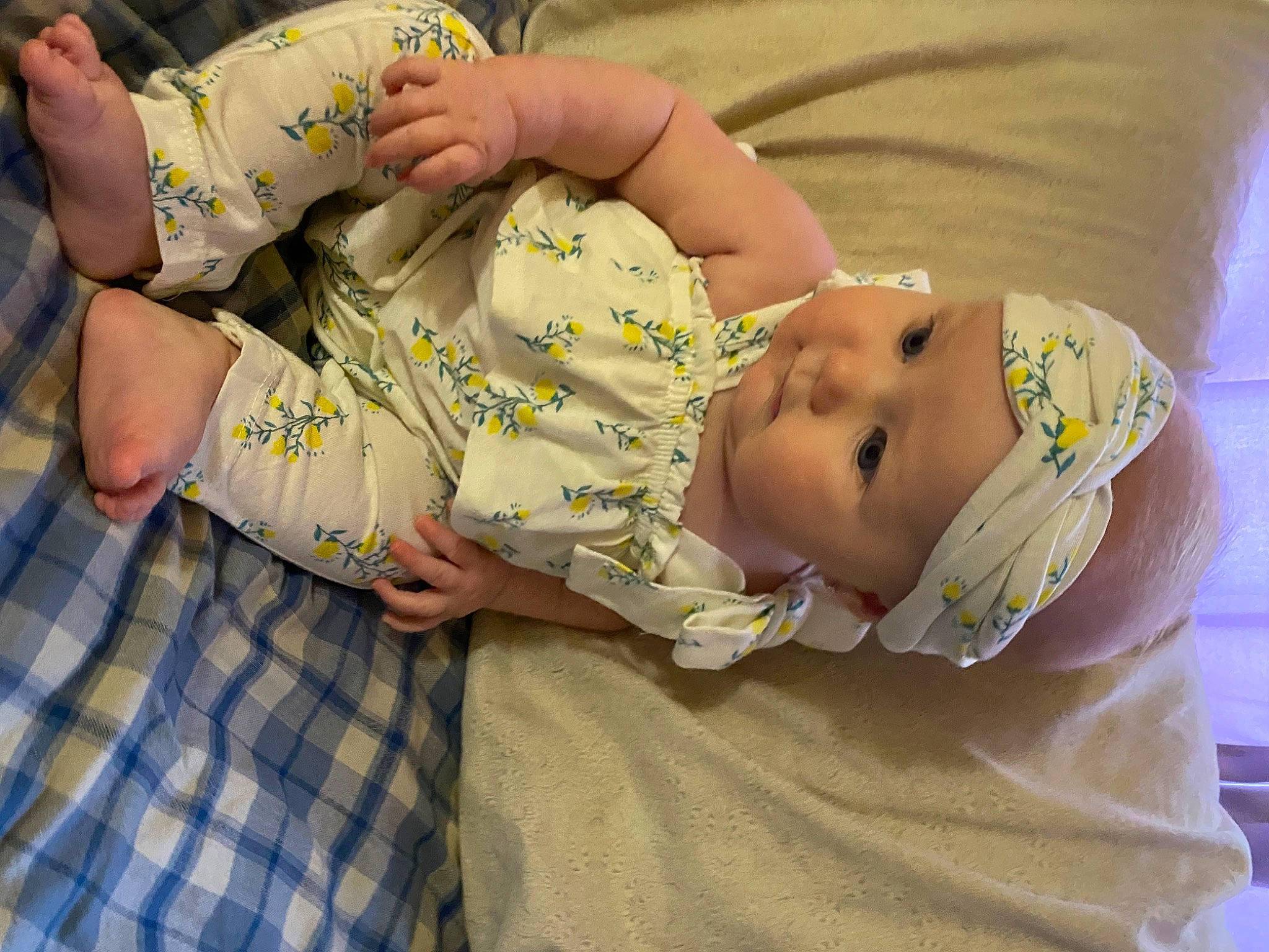 Ember is registered to the contest to win money with this photo: abdomen, baby, baby_products, baby_toddler_clothing, cheek, chest, child, comfort, elbow, eye, foot, happy, hat, headwear, pattern, person, plaid, sleeve, tartan, thigh