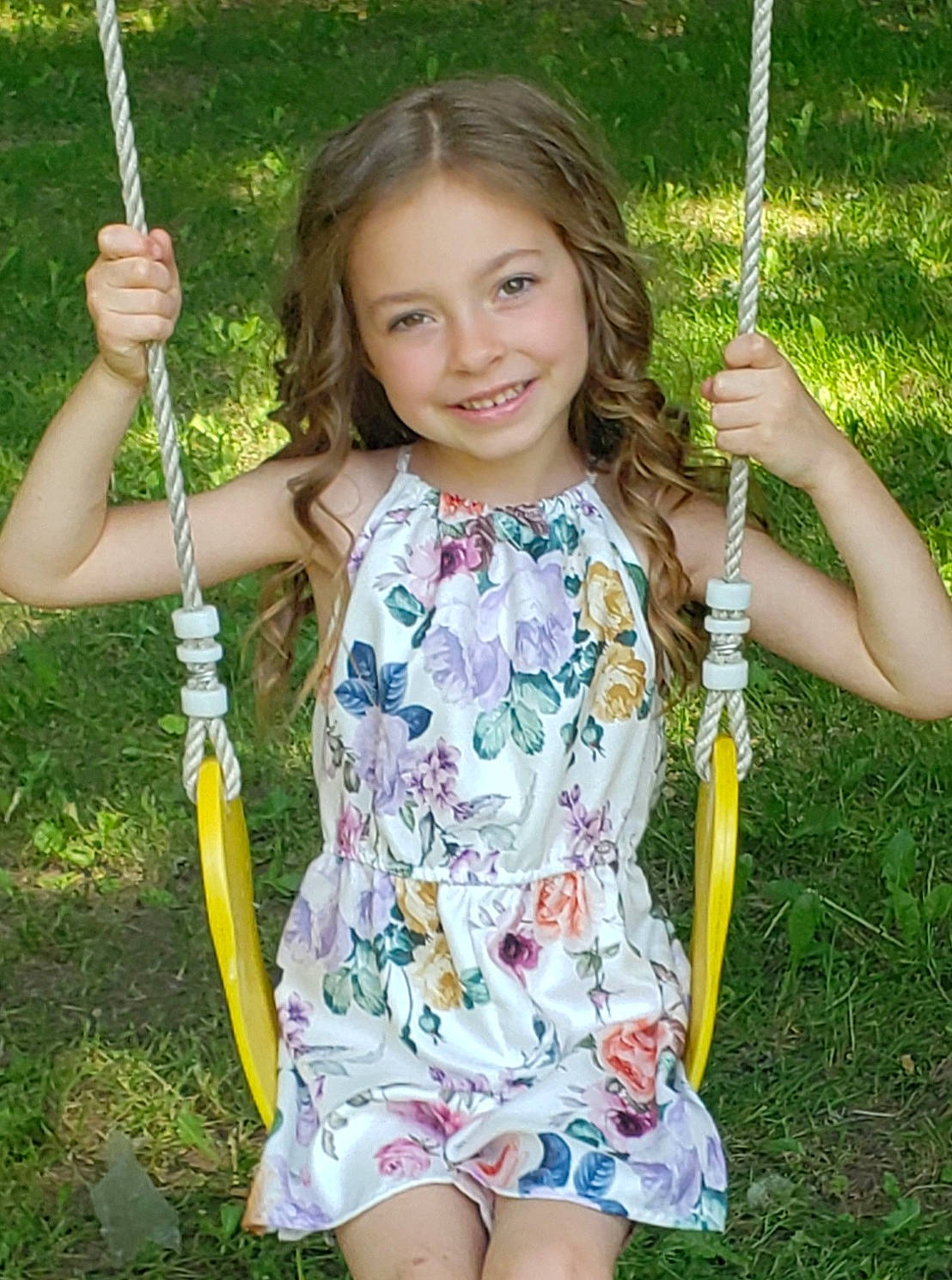Cheyenne is registered to the contest to win money with this photo: beauty, facial_expression, finger, fun, grass, grass_family, green, hand, happy, joy, leisure, outdoor_play_equipment, people, people_in_nature, person, playground, public_space, recreation, sleeve, smile