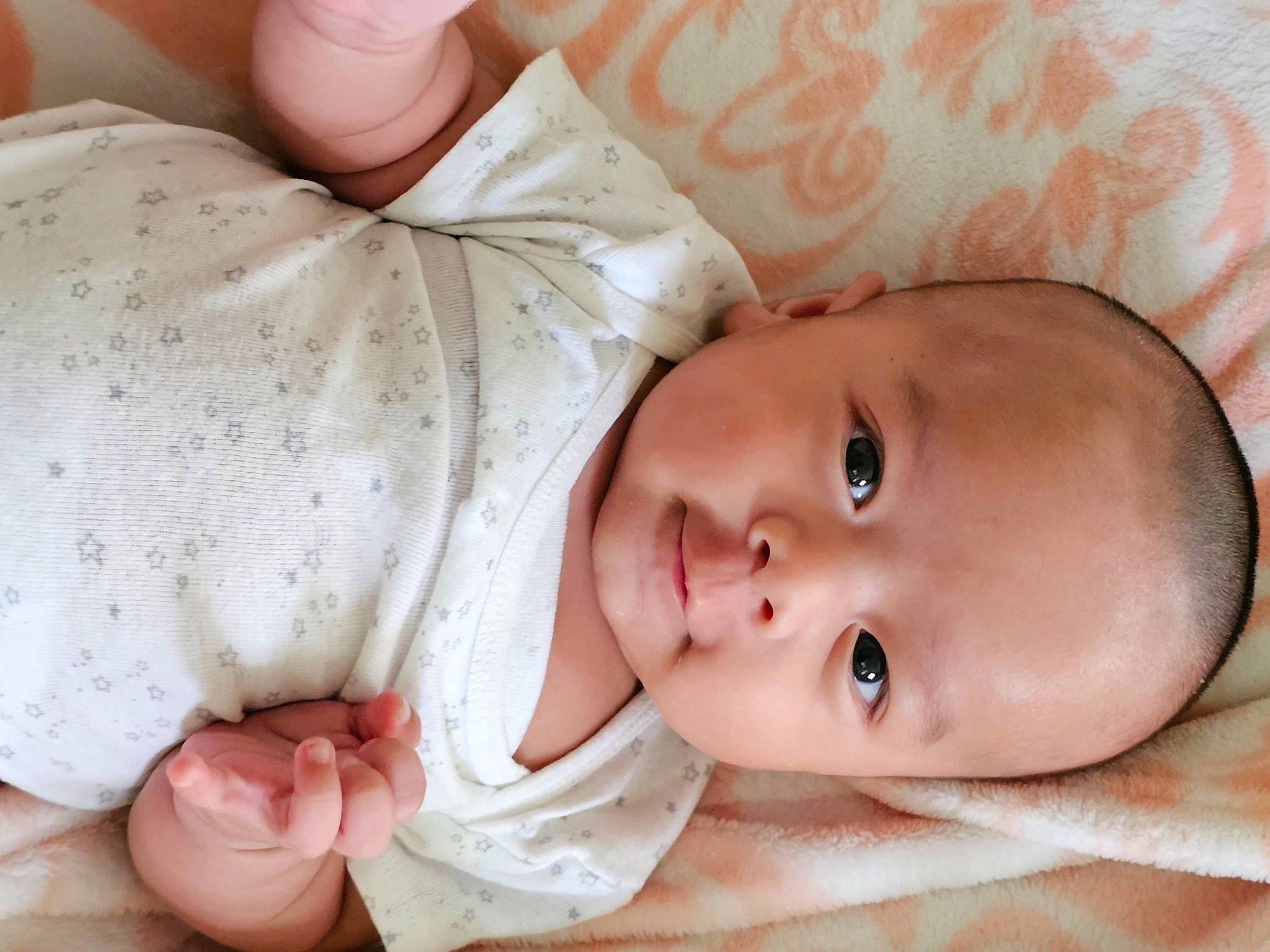 Ian is registered to the contest to win money with this photo: baby, baby_products, baby_toddler_clothing, cheek, child, comfort, finger, gesture, happy, linens, lip, nail, nose, person, portrait_photography, skin, sleeve, smile, thumb, toddler