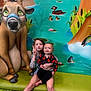 Nevaeh is registered to the contest to win money with this photo: baby, bench, child, colorful, cute, deer, duck, fish, grass, happy, indoor, mural, peace_sign, plant, playful, pond, sitting, smile, statue, water