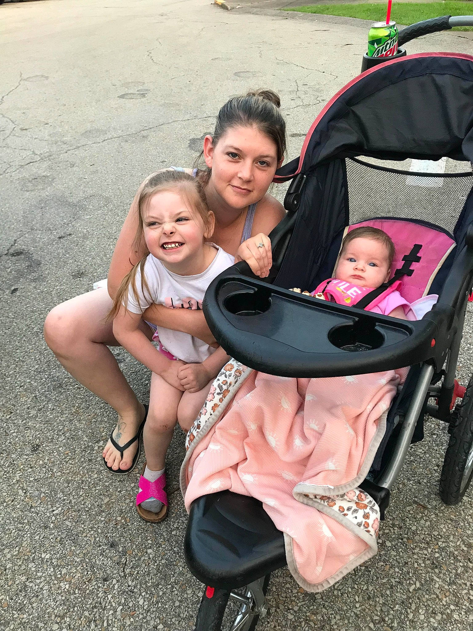 Alexis King joined the competition — help win amazing prizes! baby, baby_carriage, baby_products, child, event, fun, happy, joy, lap, leisure, magenta, motor_vehicle, person, pink, recreation, sandal, sitting, skin, smile, toddler