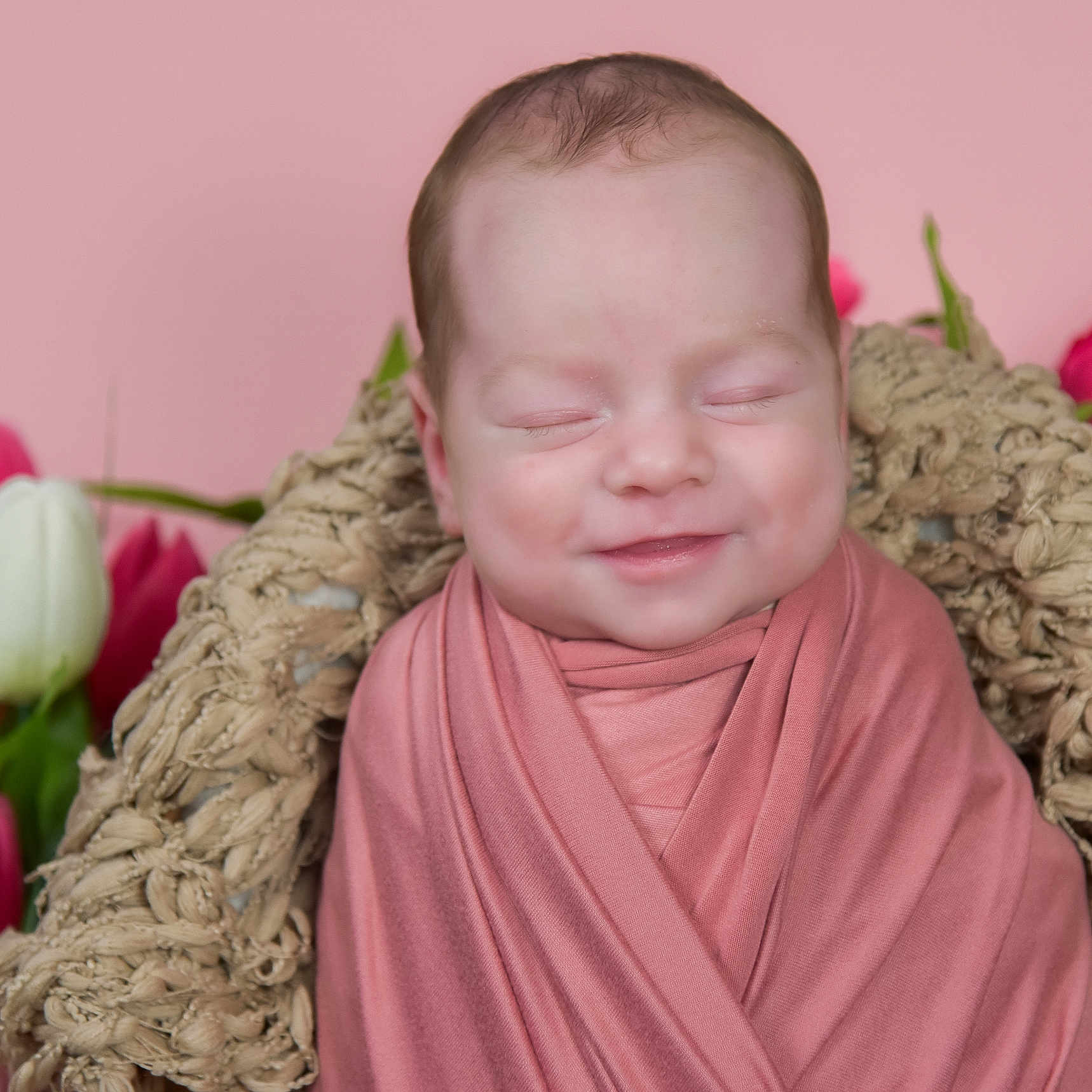 Olivia is registered to the contest to win money with this photo: baby, blanket, bodypart, face, finger, flower, flowerarrangement, flowerbouquet, hand, head, ikebana, newborn, person, petal, photography, plant, portrait, rose, tulip