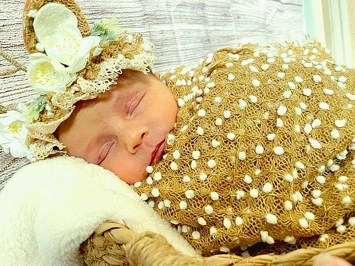 Alison is registered to the contest to win money with this photo: baby, baby_sleeping, baby_toddler_clothing, bedding, child, comfort, fashion_accessory, flooring, fur, grass, happy, hat, headgear, headpiece, headwear, linens, pattern, people_in_nature, person, room