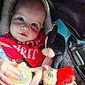 James is registered to the contest to win money with this photo: baby, blue_eyes, car_interior, car_seat, child, clothing, comfort, cute, face, hand, infant, mickey_mouse, milk_bottle, plush_toy, portrait, red_bib, seatbelt, smiling, soft_texture, sunlight