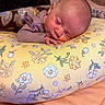 baby, newborn, sleeping, infant, portrait, face, indoors, cozy, blanket, floral, cushion, pillow, bed, home, peaceful, resting, clothing, purple, close_up, photography