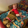 child, dog, couch, blanket, indoor, red_shirt, brown_dog, pink_collar, toddler, relaxed, furniture, carpet, home, resting, cute, pet, comfort, animal, living_room, nap