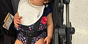 Jemaili joined the competition — help win amazing prizes! accessory, baby, bib, child, curly_hair, cute, fashion, floor, floral, footwear, indoor, infant, person, romper, seat_belt, shopping, stroller, sunglasses, toddler, toy