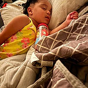 Jemaili joined the competition — help win amazing prizes! bed, blanket, bottle, braids, cartoon, child, comfort, cozy, hair, indoors, patterned_blanket, peaceful, pillow, princess, relaxation, rest, sleeping, toddler, yellow_dress, young