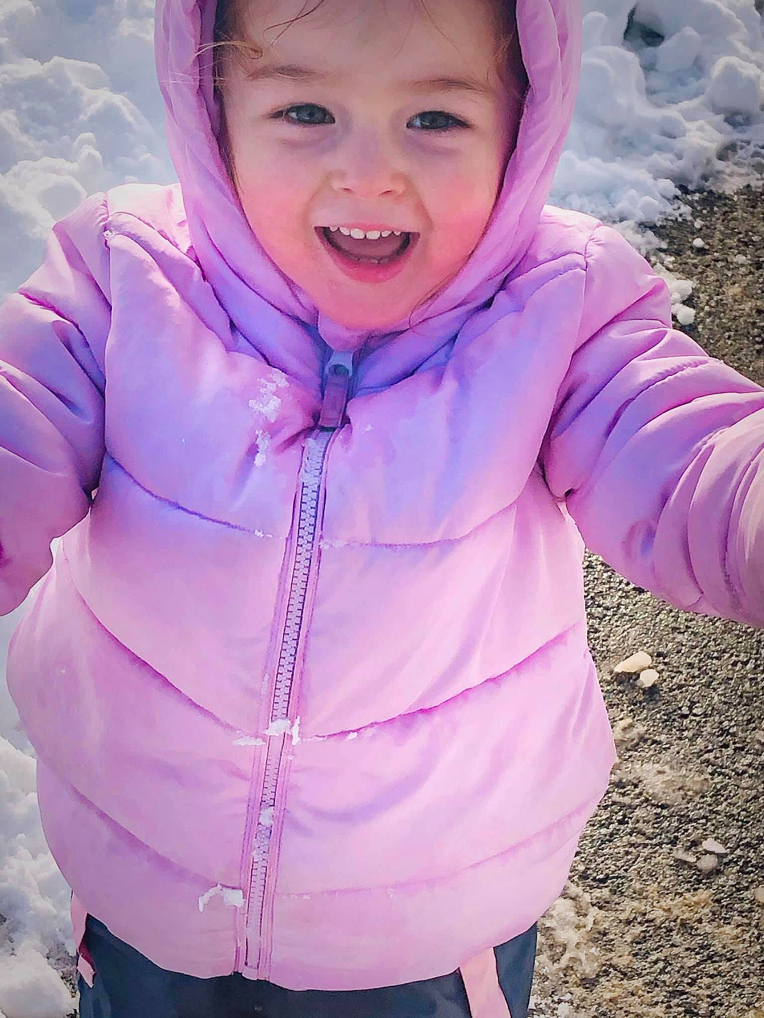 Jaida joined the competition — help win amazing prizes! baby_toddler_clothing, cheek, cool, facial_expression, happy, headwear, hood, hoodie, jacket, lavender, magenta, person, pink, playing_in_the_snow, purple, sleeve, snow, toddler, tongue, tooth