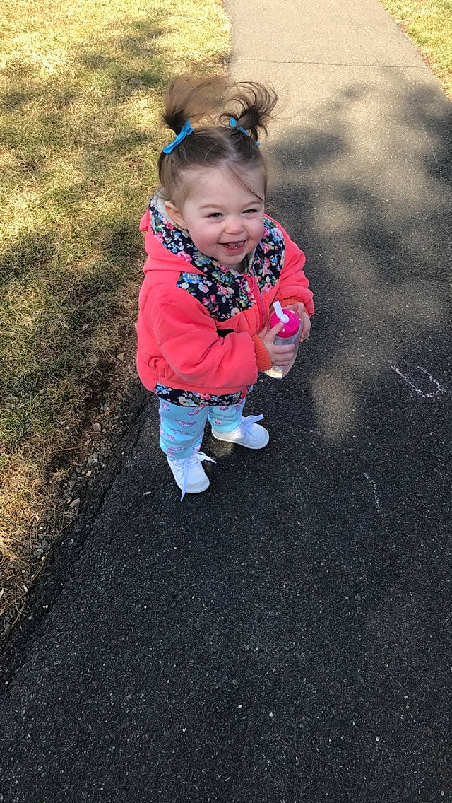 Jaida joined the competition — help win amazing prizes! asphalt, baby, child, fun, joy, leisure, person, pink, plant, play, smile, toddler, vacation, winter