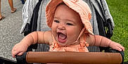 Rilynn joined the competition — help win amazing prizes! baby, stroller, hat, smiling, happy, outdoor, people, sidewalk, grass, clothing, sunhat, child, infant, walking, family, daylight, road, casual, person, fun