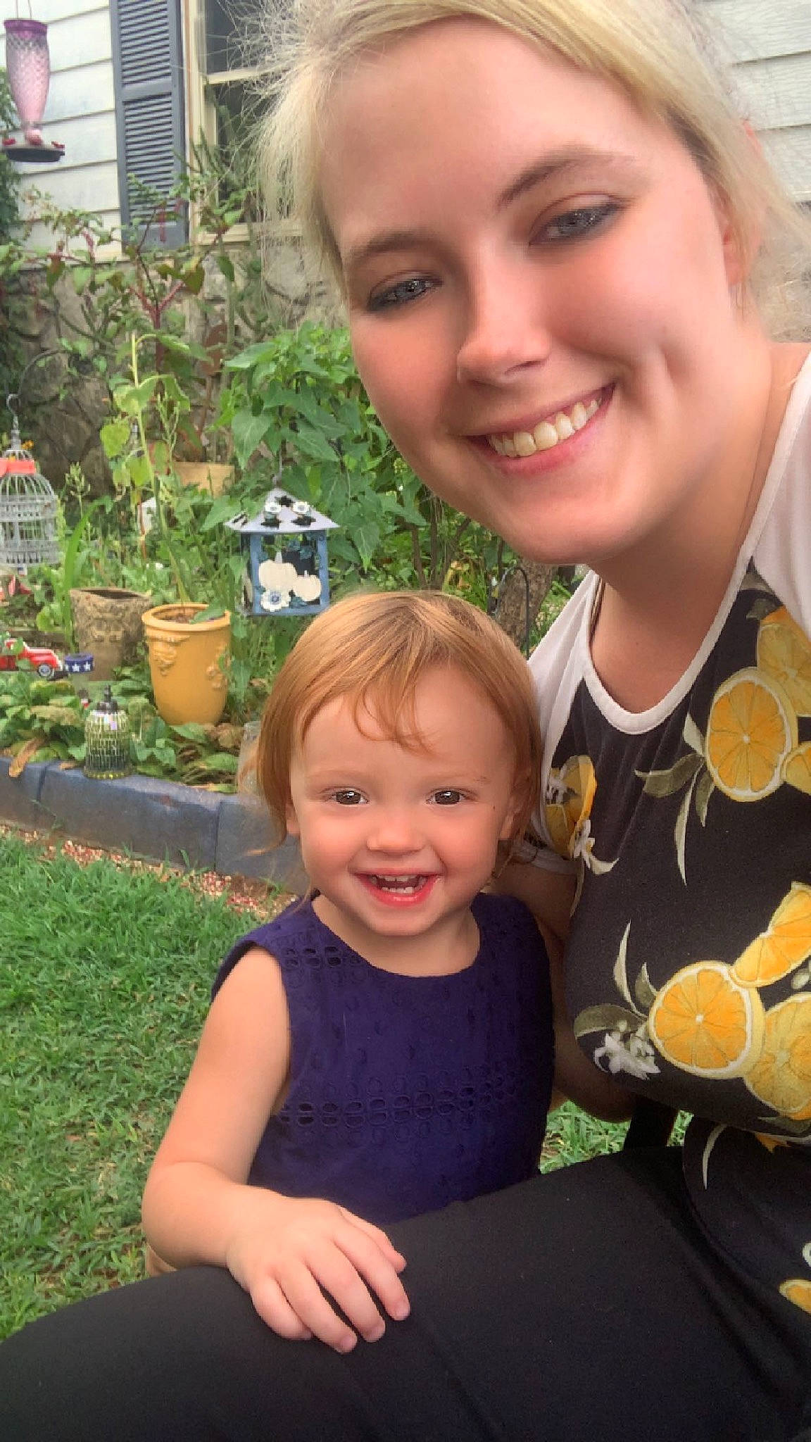 Michaela is registered to the contest to win money with this photo: botany, eye, face, facial_expression, flowerpot, fun, grass, hair, hairstyle, happy, head, houseplant, iris, joy, leaf, organ, person, plant, skin, smile