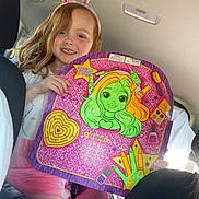 Michaela joined the competition — help win amazing prizes! child, girl, bunny_ears, pink, smile, car_interior, seat, toy, colorful, board, long_hair, casual_clothing, happy, portrait, seatbelt, window, sunlight, fun, accessory, playful