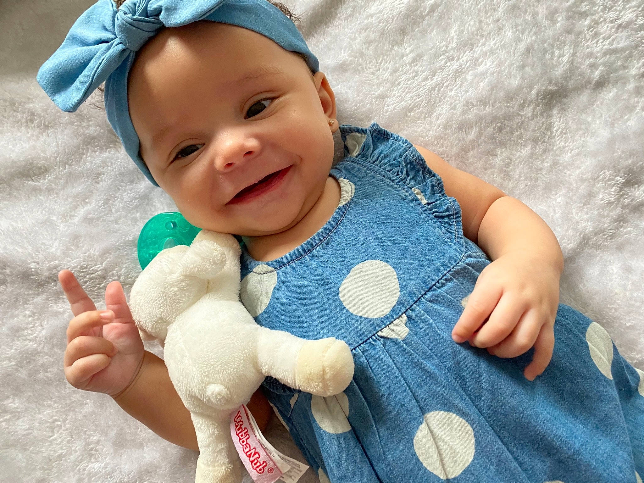 Augustina joined the competition — help win amazing prizes! arm, azure, baby_toddler_clothing, blue, cap, eye, face, facial_expression, finger, gesture, hand, joy, nose, organ, person, skin, sleeve, smile, textile, thumb
